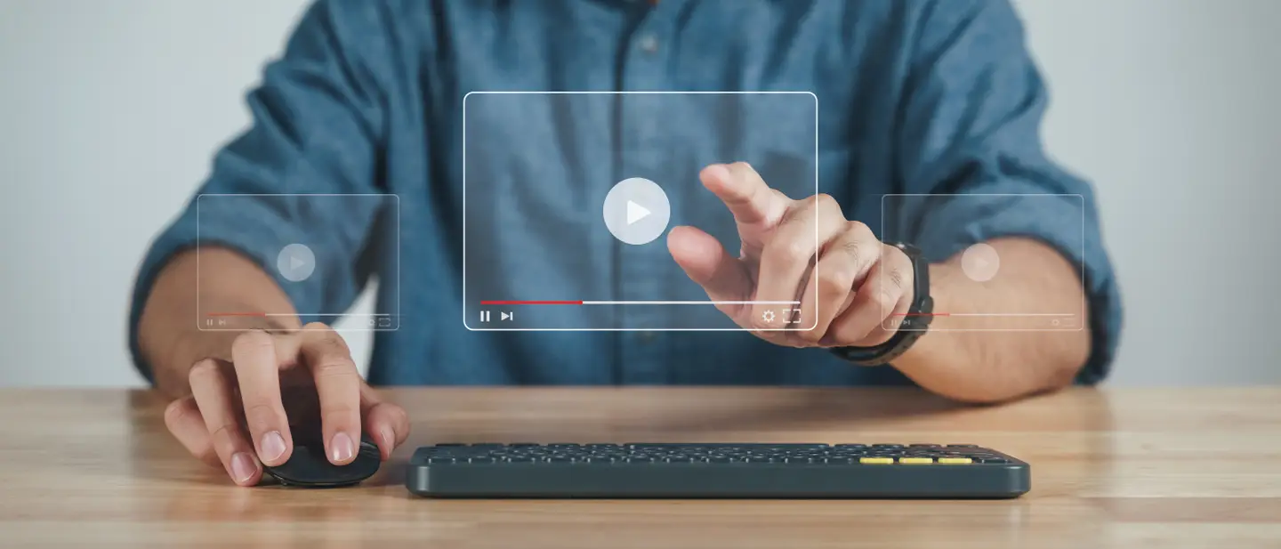 Transparent computer with man pointing finger to play video